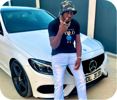 Shorto standing in front of a white Mercedes